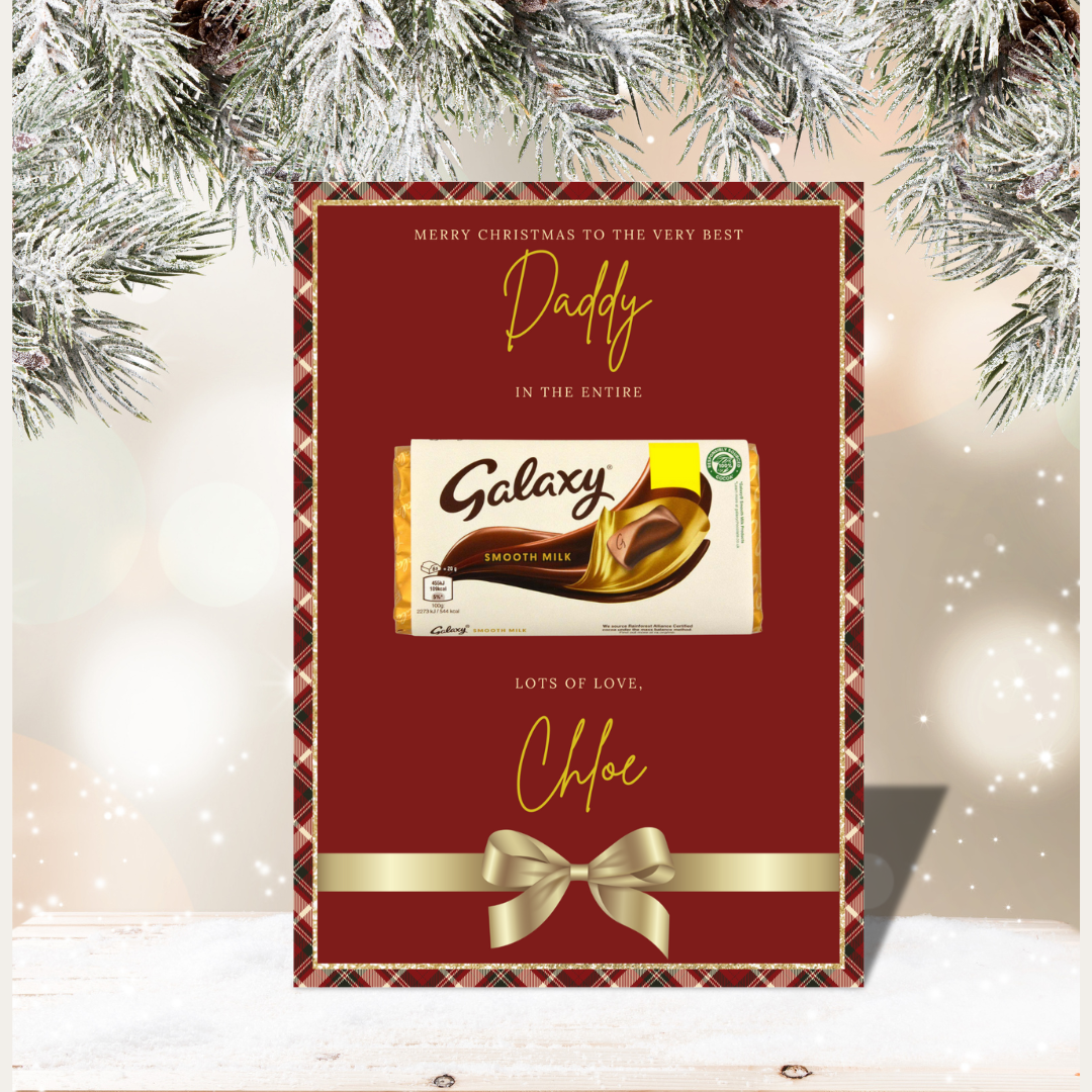 Personalized Galaxy chocolate bar packaging with festive text and bow, set against a Christmas tree background.
