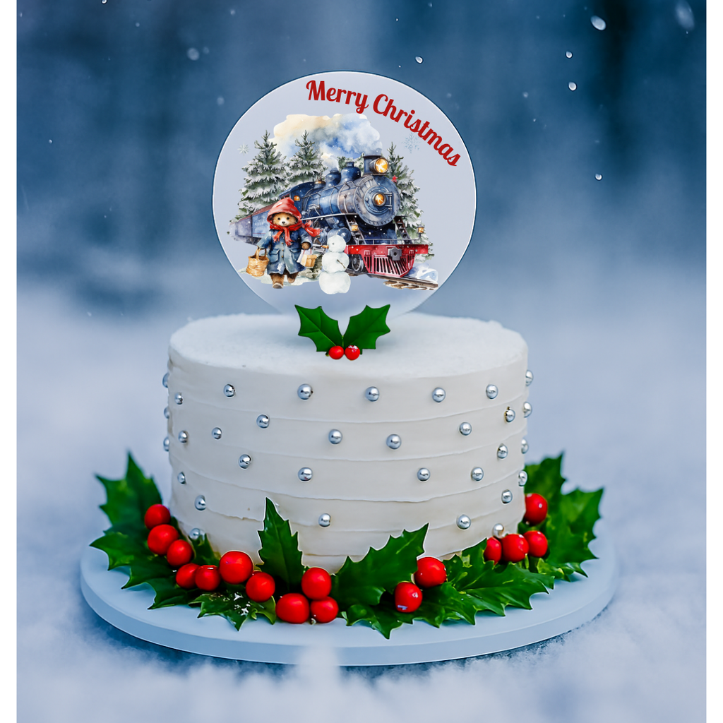 White Christmas cake with decorative elements and a 'Merry Christmas' topper against a snowy background.
