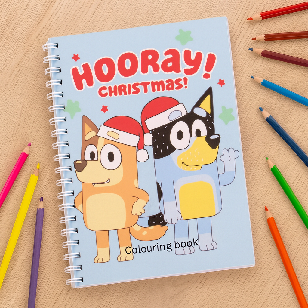Coloring book titled 'Hooray Christmas!' with cartoon characters on a wooden surface with coloring pencils.