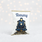 Luxury personalised blue Christmas treat bag with vintage train illustration and name ‘Tommy’ in festive font