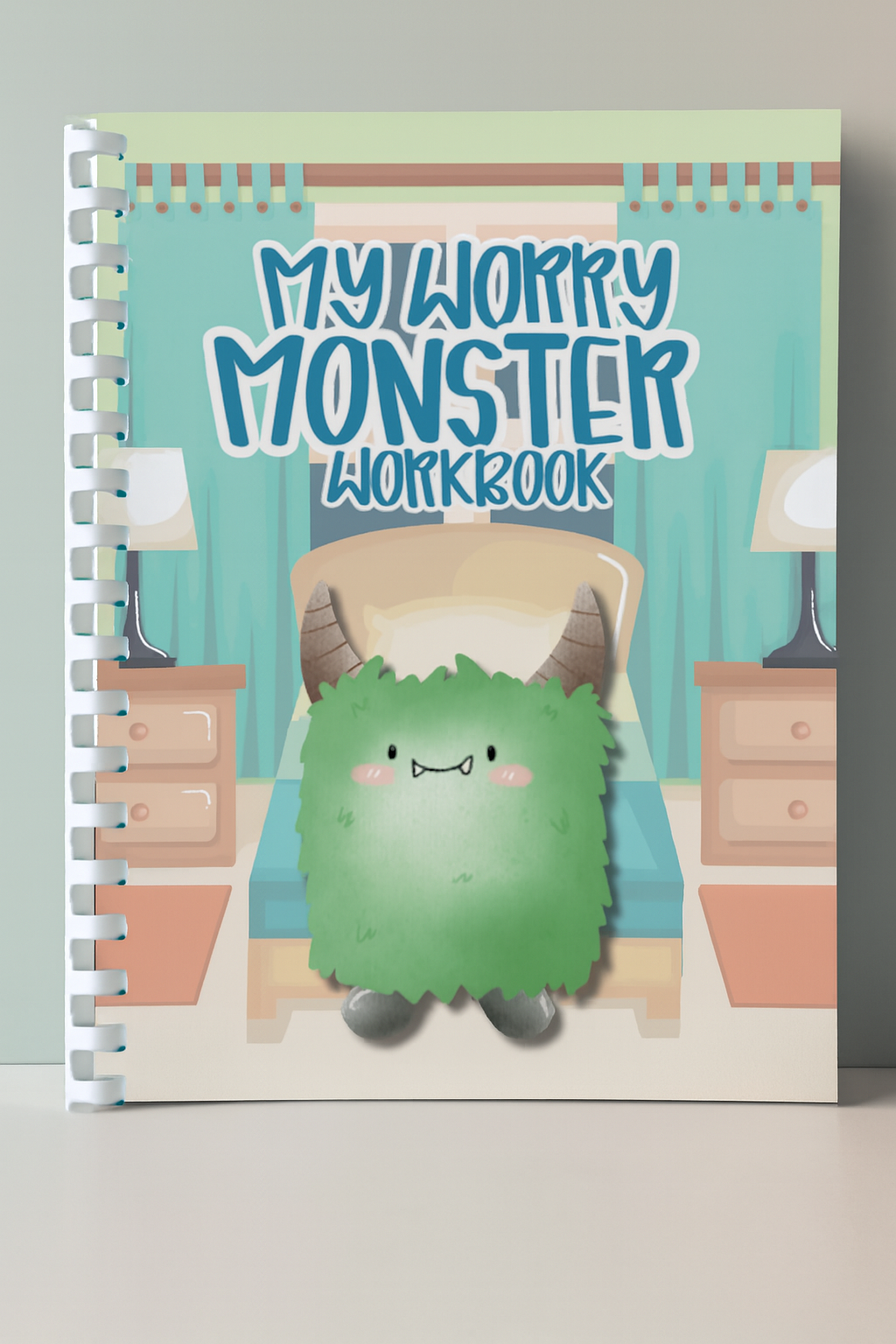 Children's workbook titled 'My Worry Monster Workbook' with a green monster illustration on a light gray background.